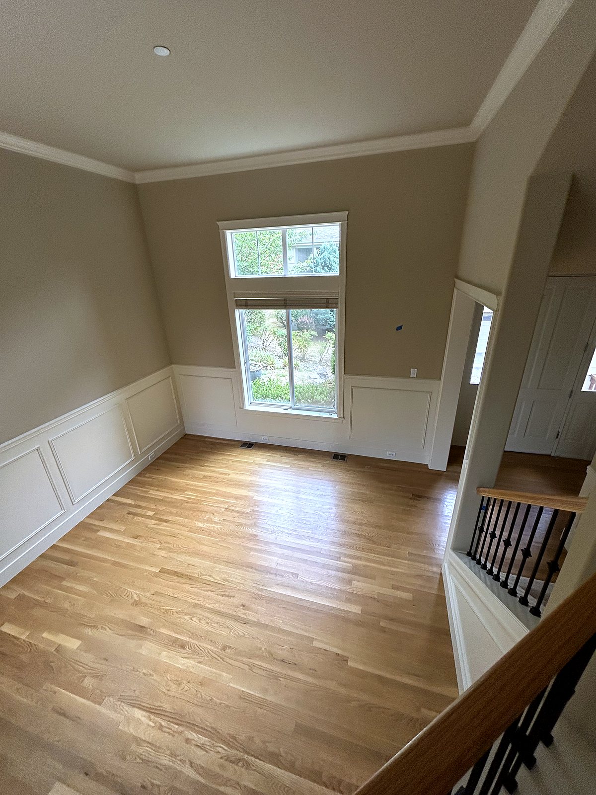 Newly renovated room with hardwood floors and wainscoting, King County.