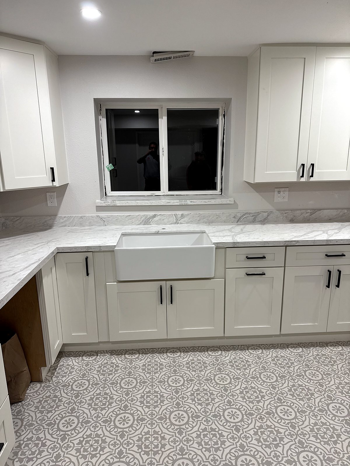 White shaker cabinet kitchen renovation with marble counters, King County.