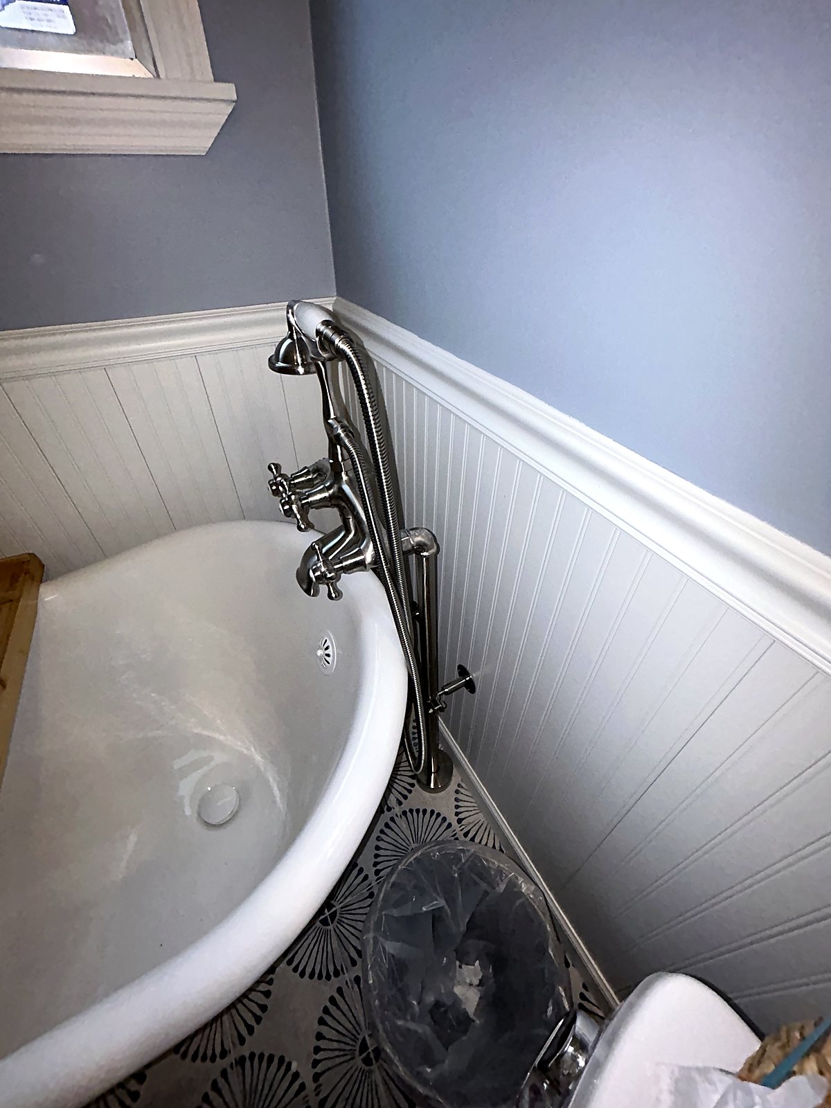 Clawfoot tub plumbing installation with chrome fixtures, King County.