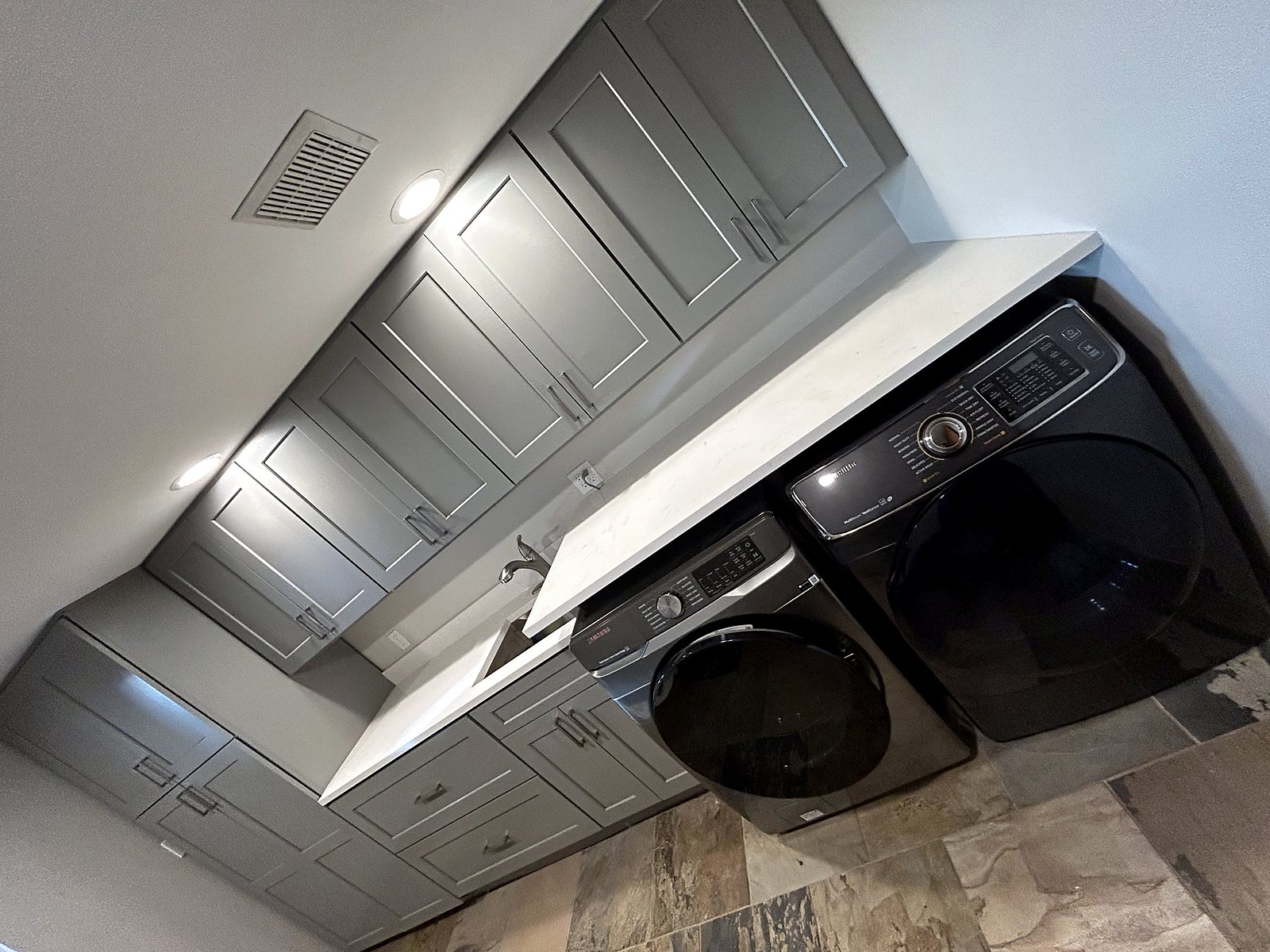 Gray shaker laundry room cabinets and countertop renovation King County.