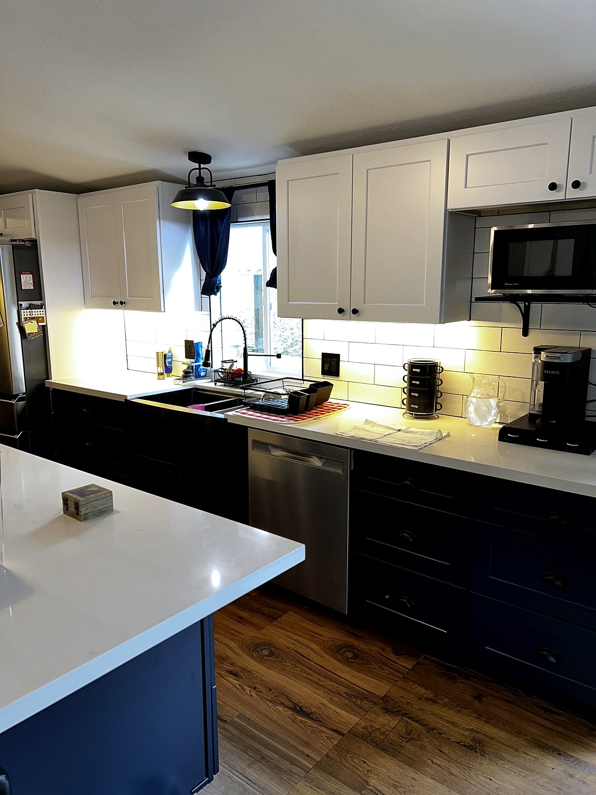 Modern navy and white kitchen remodel with island, King County.