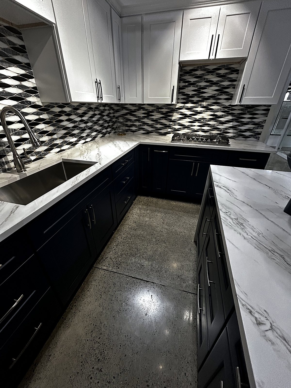 Dark and white kitchen cabinets with diamond tile backsplash, King County renovation.